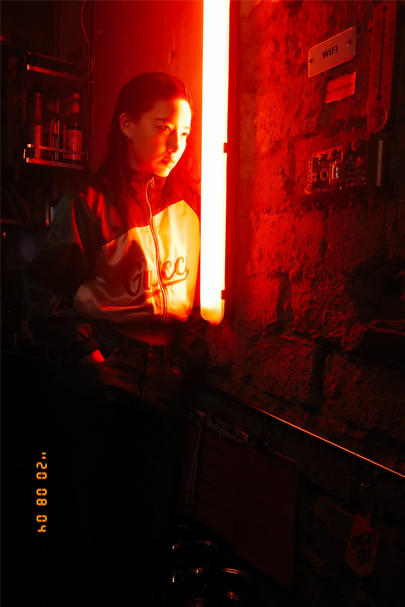 Li Sidanni photographed in the red neon corner for Harper's Bazaar